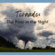 A tornado forms out of dark clouds